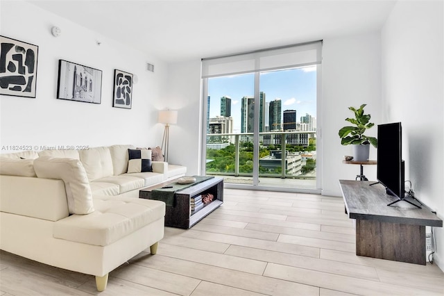 4250 Biscayne Blvd Unit 1217, Miami, FL 33137 - living area featuring floor to ceiling windows and light wood finished floors