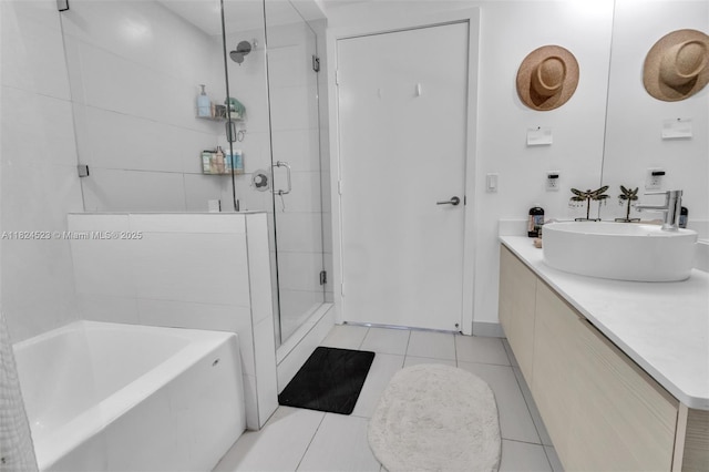 4250 Biscayne Blvd Unit 1217, Miami, FL 33137 - bathroom with a stall shower, vanity, a garden tub, and tile patterned flooring
