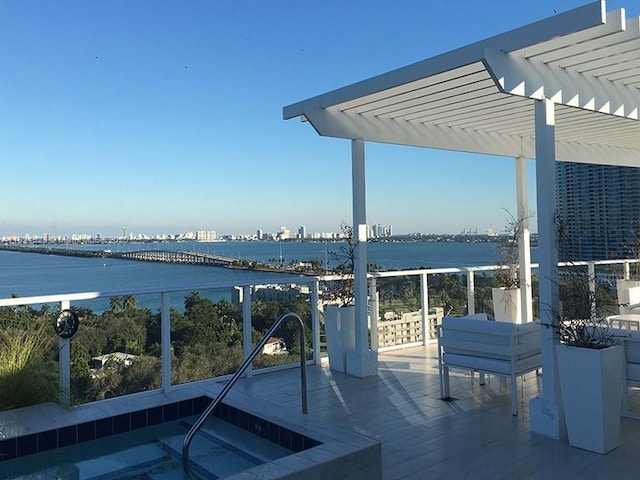 4250 Biscayne Blvd Unit 1217, Miami, FL 33137 - wooden terrace featuring a pergola and a water view