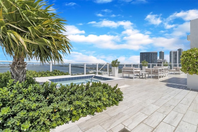 4250 Biscayne Blvd Unit 1217, Miami, FL 33137 - view of swimming pool featuring a water view, an outdoor hangout area, a patio, and a view of city