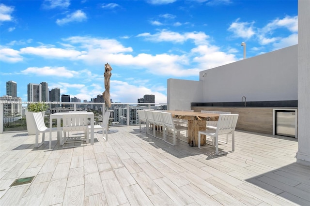 4250 Biscayne Blvd Unit 1217, Miami, FL 33137 - patio / terrace featuring a skyline view and outdoor dining space