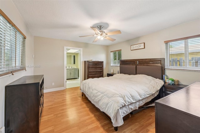 1321 NW 75th Ter, Plantation, FL 33313 - bedroom featuring light wood finished floors, a ceiling fan, and ensuite bathroom