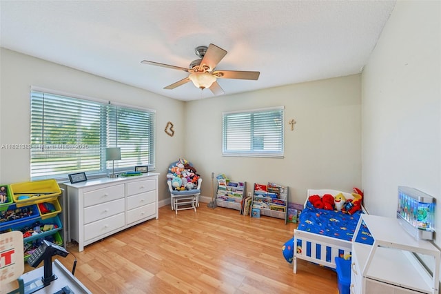 1321 NW 75th Ter, Plantation, FL 33313 - bedroom with light wood finished floors and a ceiling fan