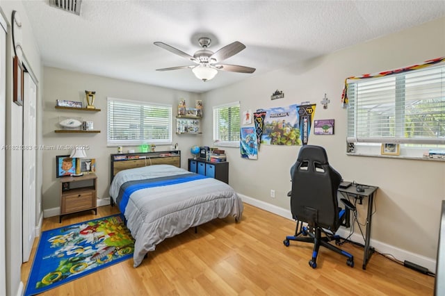 1321 NW 75th Ter, Plantation, FL 33313 - bedroom featuring wood finished floors, ceiling fan, a textured ceiling, and a closet