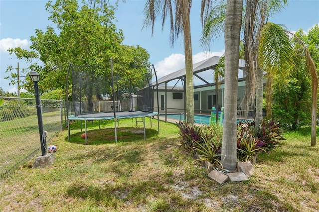 1321 NW 75th Ter, Plantation, FL 33313 - view of yard with a lanai and a trampoline