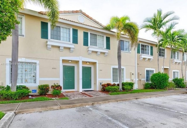 5907 Glasgow Way, Tamarac, FL 33321 - view of building exterior featuring uncovered parking