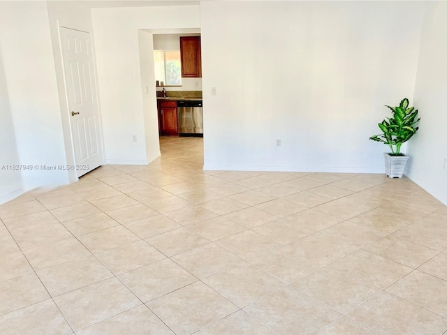 5907 Glasgow Way, Tamarac, FL 33321 - empty room with light tile patterned floors and baseboards