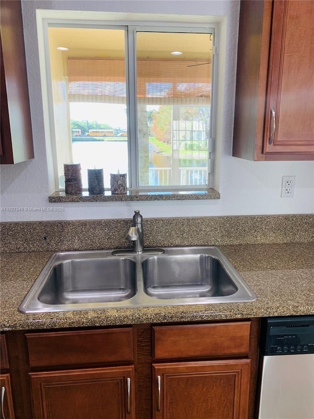 5907 Glasgow Way, Tamarac, FL 33321 - kitchen view of stainless steel dishwasher, dark countertops, and brown cabinets