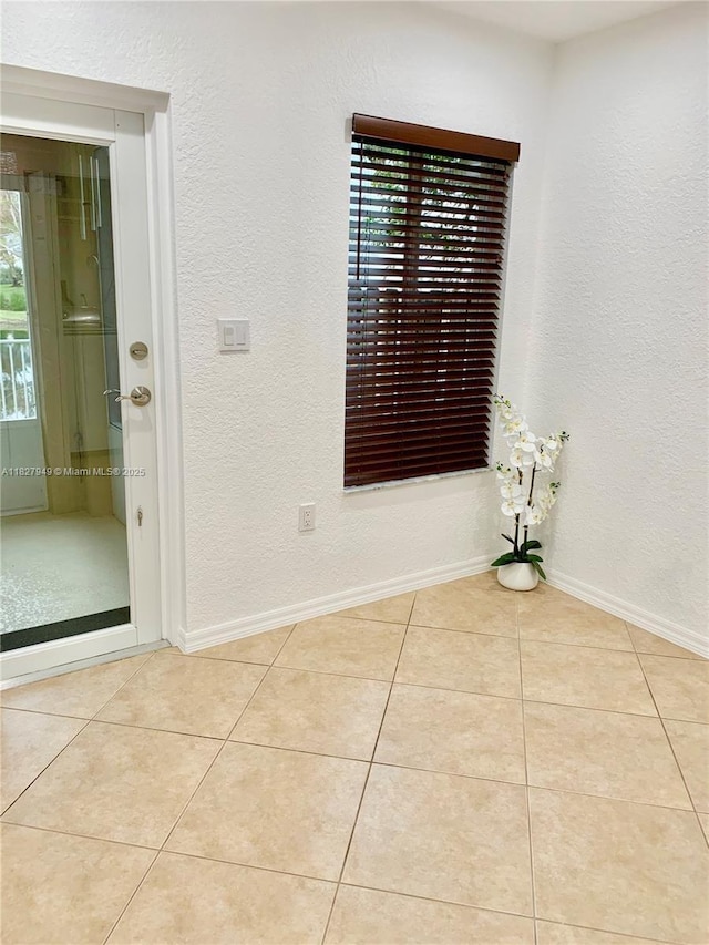 5907 Glasgow Way, Tamarac, FL 33321 - tiled spare room with a textured wall and baseboards