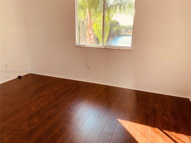 5907 Glasgow Way, Tamarac, FL 33321 - unfurnished room with baseboards and wood finished floors