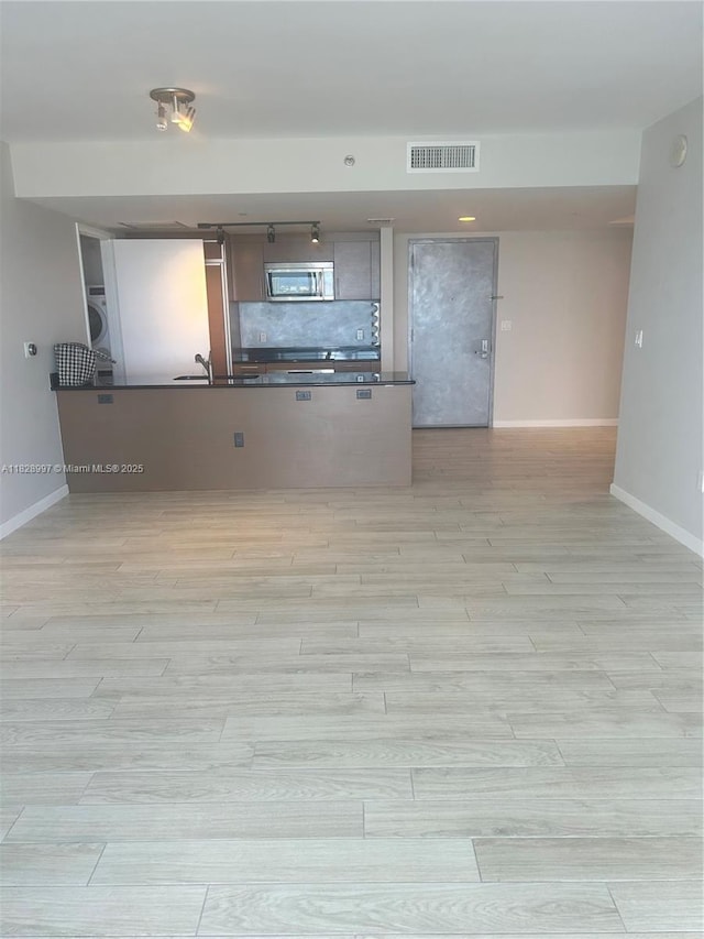 50 Biscayne Blvd Unit 4706, Miami, FL 33132 - spare room featuring light wood finished floors and washer / dryer