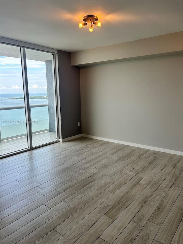 50 Biscayne Blvd Unit 4706, Miami, FL 33132 - spare room with wood finished floors and baseboards