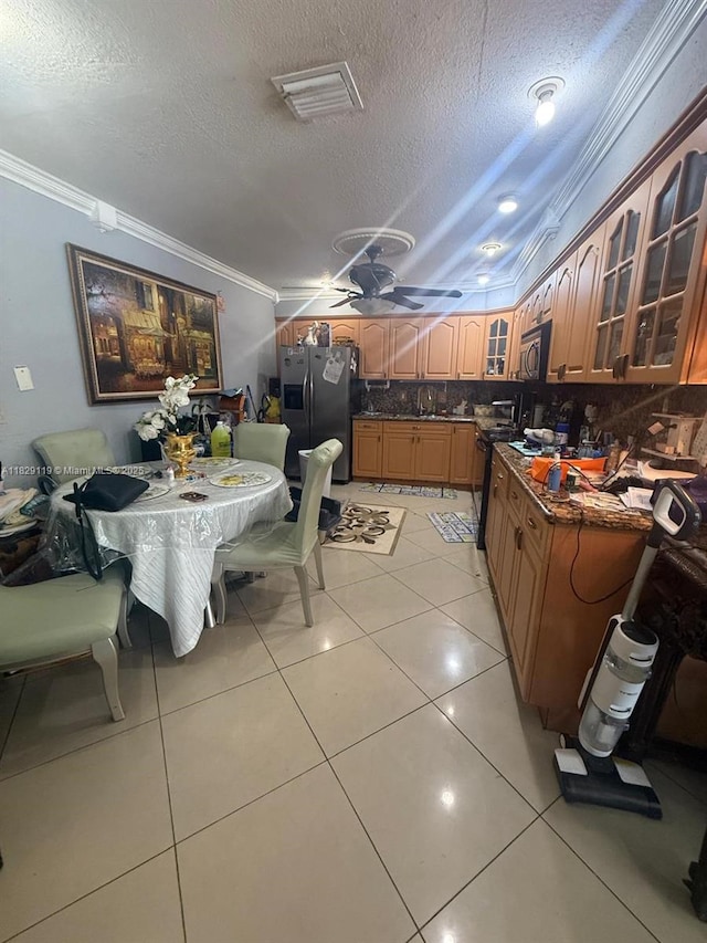 7900 SW 21st Ter, Miami, FL 33155 - kitchen with appliances with stainless steel finishes, ornamental molding, a textured ceiling, glass insert cabinets, and dark countertops