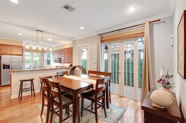 1110 SE 4th Ave, Fort Lauderdale, FL 33316 - dining space with crown molding, light wood finished floors, recessed lighting, and french doors