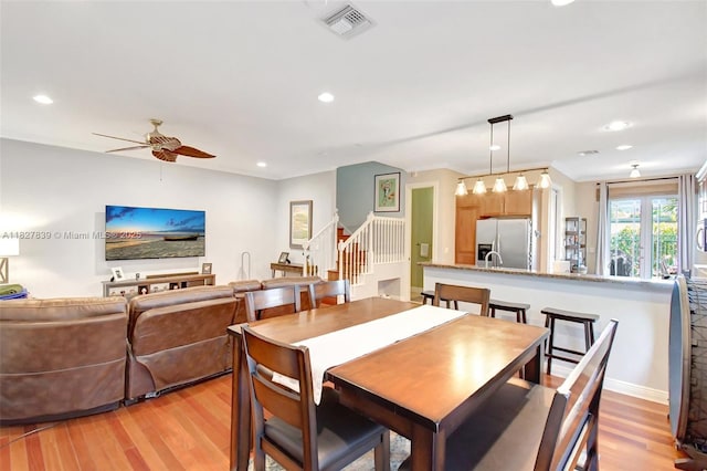 1110 SE 4th Ave, Fort Lauderdale, FL 33316 - dining space with light wood finished floors, stairs, ceiling fan, and recessed lighting