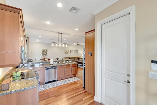1110 SE 4th Ave, Fort Lauderdale, FL 33316 - kitchen with stainless steel dishwasher, light wood finished floors, a peninsula, hanging light fixtures, and recessed lighting