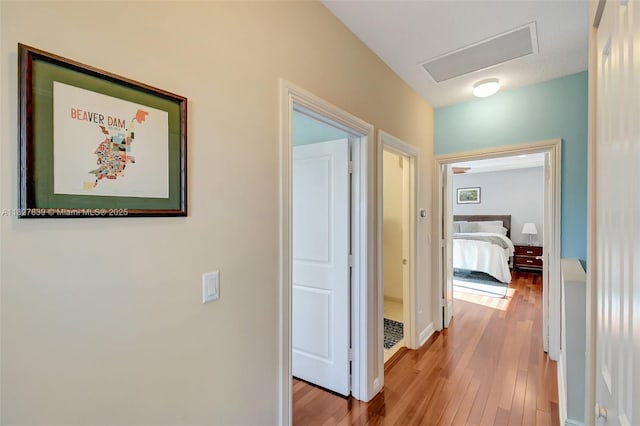 1110 SE 4th Ave, Fort Lauderdale, FL 33316 - hallway with attic access and wood finished floors