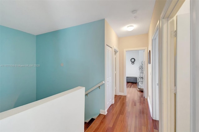 1110 SE 4th Ave, Fort Lauderdale, FL 33316 - hall with an upstairs landing, wood finished floors, and a baseboard heating unit