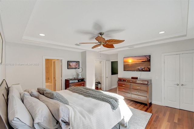 1110 SE 4th Ave, Fort Lauderdale, FL 33316 - bedroom with a tray ceiling, wood finished floors, recessed lighting, a ceiling fan, and a closet