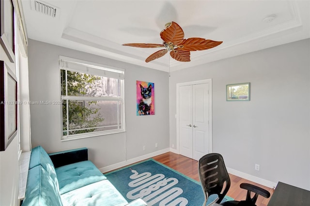 1110 SE 4th Ave, Fort Lauderdale, FL 33316 - home office featuring a tray ceiling, ceiling fan, and wood finished floors