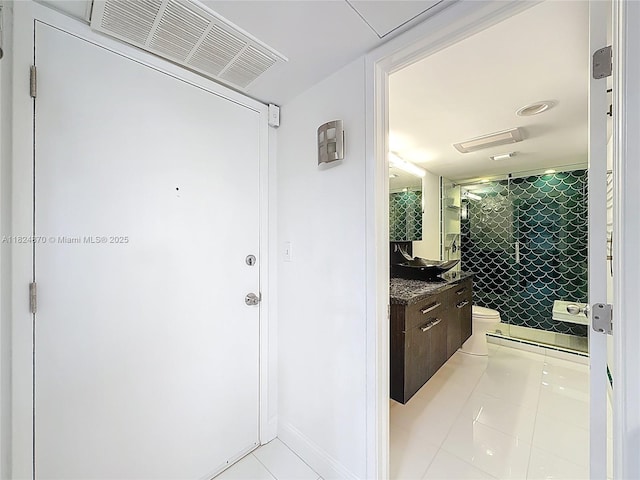 101 E Mcnab Rd Unit 311, Pompano Beach, FL 33060 - bathroom with vanity, tile patterned floors, and a shower