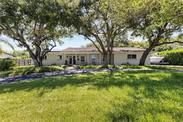16400 SW 80th Ave, Palmetto Bay, FL 33157 - view of front facade with solar panels, stucco siding, and a porch