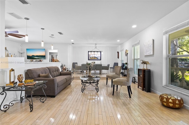 16400 SW 80th Ave, Palmetto Bay, FL 33157 - living room featuring a ceiling fan, light wood finished floors, recessed lighting, and a chandelier