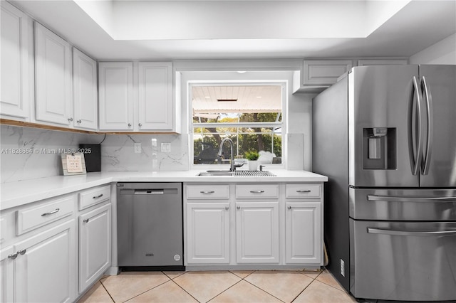 16400 SW 80th Ave, Palmetto Bay, FL 33157 - kitchen featuring appliances with stainless steel finishes, light tile patterned flooring, light countertops, and white cabinetry