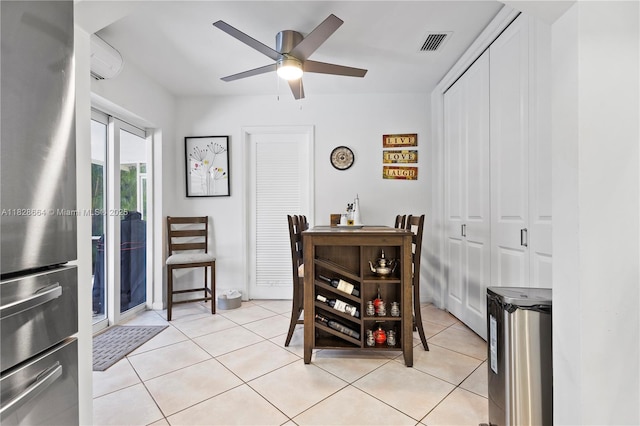16400 SW 80th Ave, Palmetto Bay, FL 33157 - dining space featuring a ceiling fan, light tile patterned floors, and a wall unit AC