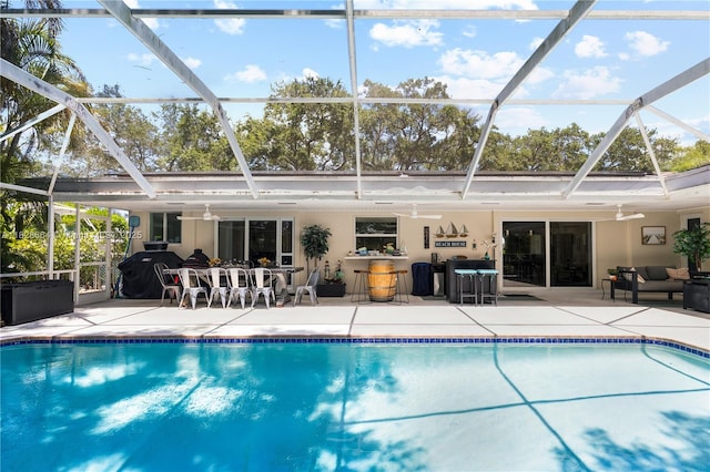 16400 SW 80th Ave, Palmetto Bay, FL 33157 - swimming pool featuring a patio area, an outdoor hangout area, a lanai, and a ceiling fan