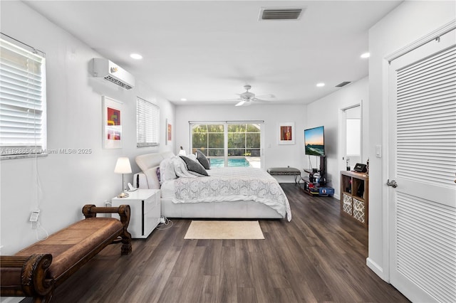16400 SW 80th Ave, Palmetto Bay, FL 33157 - bedroom featuring a wall mounted AC, access to exterior, dark wood-style floors, recessed lighting, and ceiling fan