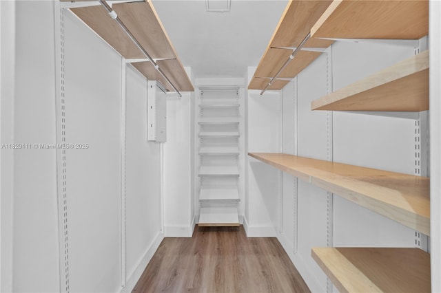 10275 Collins Ave Unit 1035, Bal Harbour, FL 33154 - spacious closet featuring wood finished floors