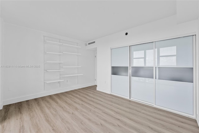 10275 Collins Ave Unit 1035, Bal Harbour, FL 33154 - unfurnished room featuring wood finished floors and baseboards