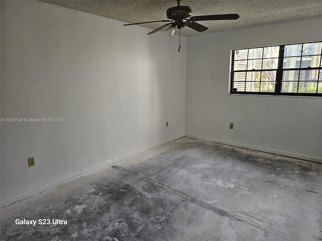 907 NE 199th St Unit 106, Miami, FL 33179 - empty room featuring concrete floors, a ceiling fan, and a textured ceiling