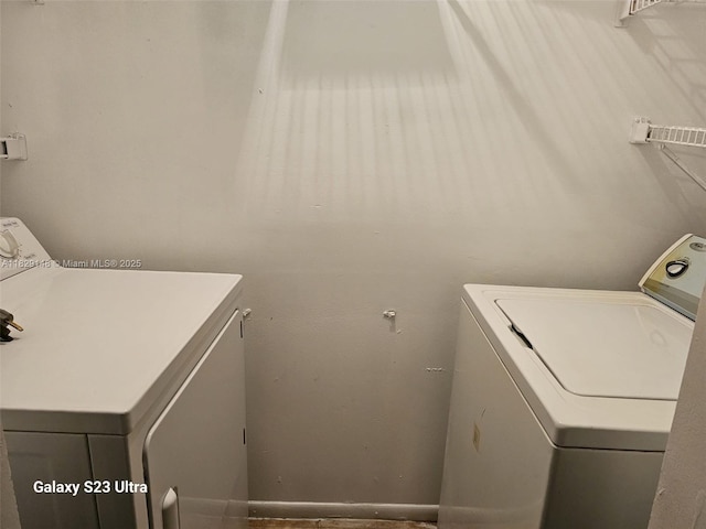 907 NE 199th St Unit 106, Miami, FL 33179 - washroom featuring washer and clothes dryer