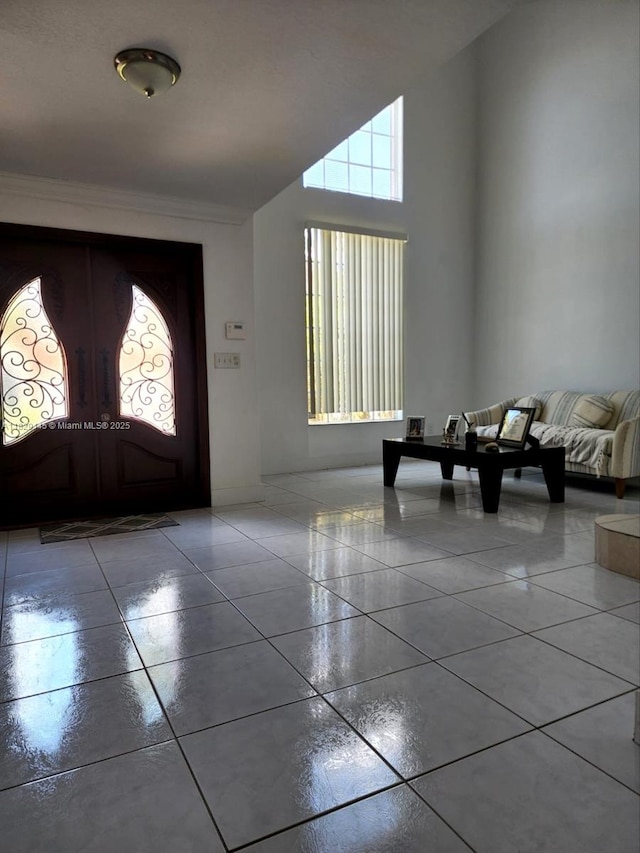 10878 NW 51st Ln, Doral, FL 33178 - foyer featuring tile patterned flooring, ornamental molding, french doors, and a towering ceiling