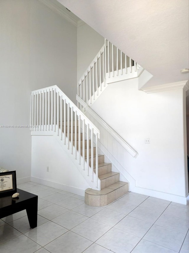 10878 NW 51st Ln, Doral, FL 33178 - staircase featuring crown molding, tile patterned flooring, and a towering ceiling