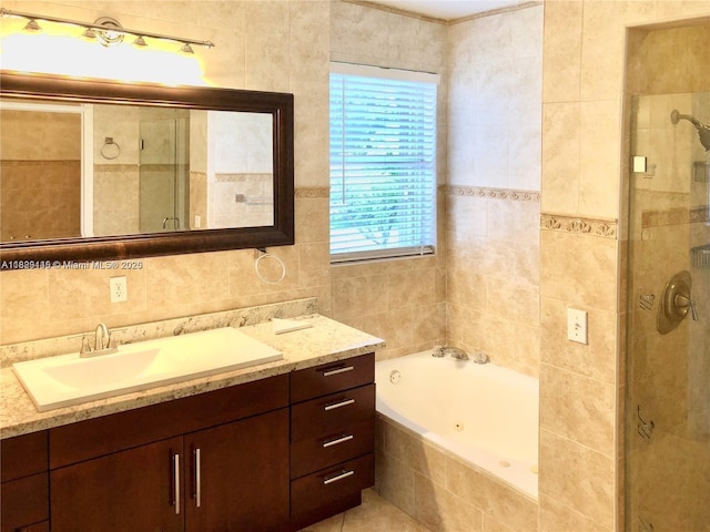 10878 NW 51st Ln, Doral, FL 33178 - bathroom featuring tile walls, vanity, a tub with jets, and a stall shower