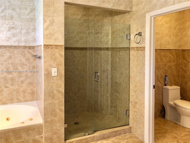 10878 NW 51st Ln, Doral, FL 33178 - full bathroom with tile walls, tile patterned flooring, a stall shower, and a jetted tub