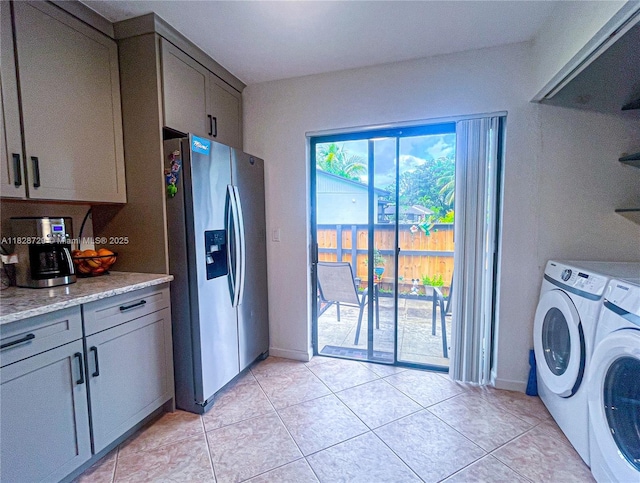 61 W Seminole Ct W, Royal Palm Beach, FL 33411 - laundry room featuring independent washer and dryer and light tile patterned floors
