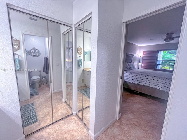 61 W Seminole Ct W, Royal Palm Beach, FL 33411 - full bathroom with a textured wall, tile patterned flooring, vanity, and ensuite bathroom