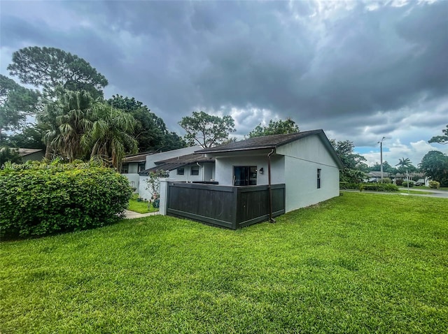 61 W Seminole Ct W, Royal Palm Beach, FL 33411 - back of property featuring stucco siding