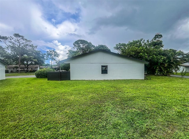 61 W Seminole Ct W, Royal Palm Beach, FL 33411 - view of property exterior with a lawn