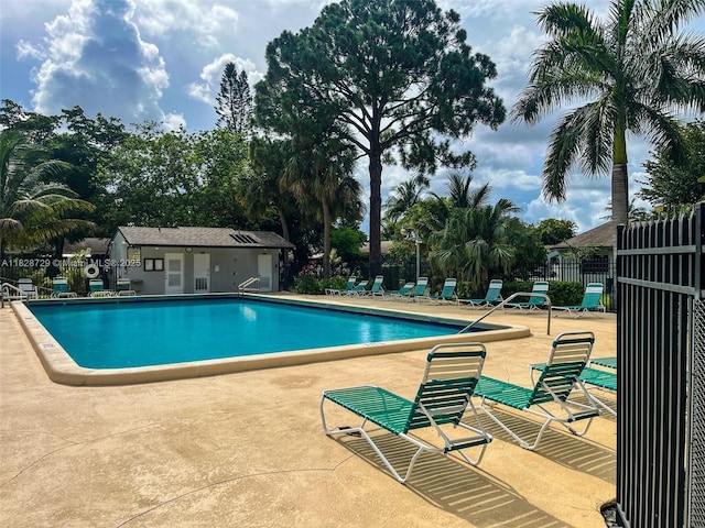 61 W Seminole Ct W, Royal Palm Beach, FL 33411 - community pool featuring a patio