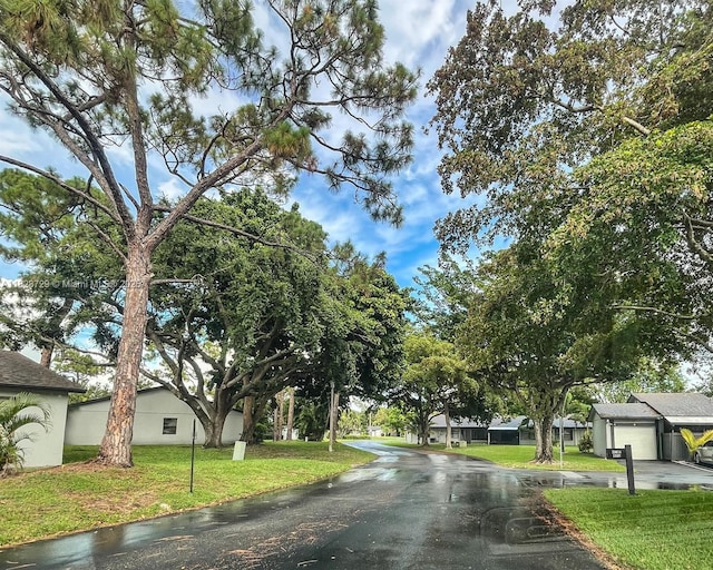 61 W Seminole Ct W, Royal Palm Beach, FL 33411 - view of asphalt street featuring a residential view