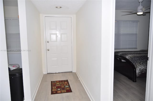700 SW 128th Ave Unit 106C, Pembroke Pines, FL 33027 - doorway to outside featuring light wood-style flooring and a ceiling fan