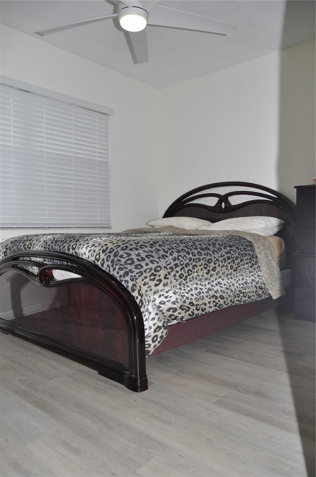 700 SW 128th Ave Unit 106C, Pembroke Pines, FL 33027 - bedroom with wood finished floors and a ceiling fan