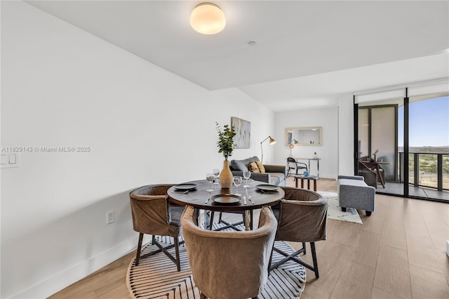 121 NE 34th St Unit 1514, Miami, FL 33137 - dining room with light wood-style flooring