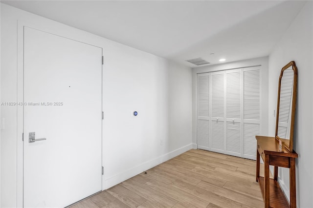 121 NE 34th St Unit 1514, Miami, FL 33137 - unfurnished bedroom with light wood-style flooring, a closet, and recessed lighting