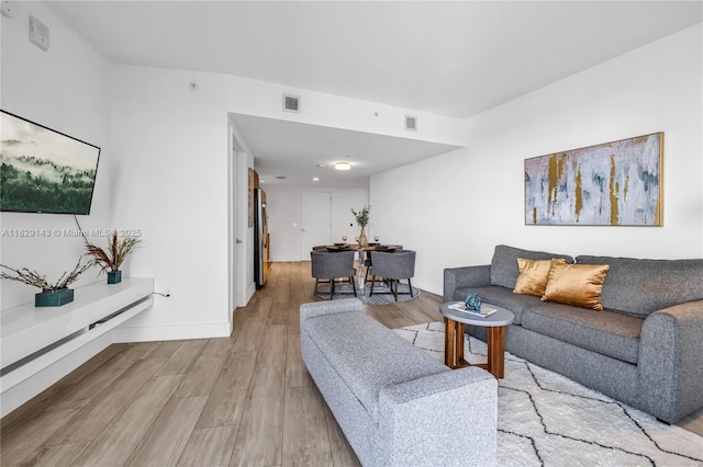 121 NE 34th St Unit 1514, Miami, FL 33137 - living room featuring wood finished floors and baseboards